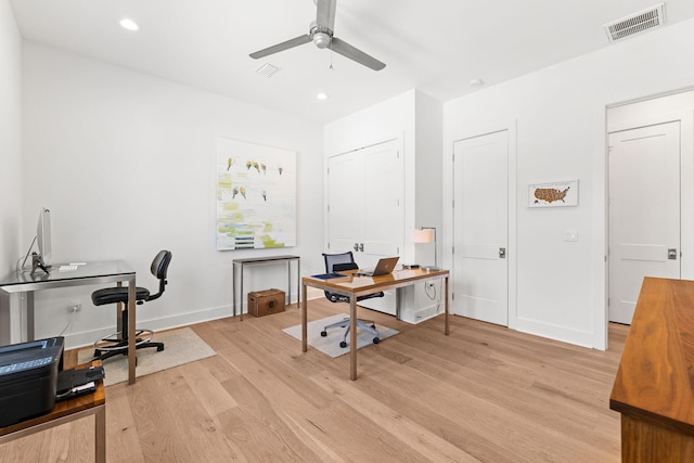 office area with light hardwood / wood-style floors and ceiling fan