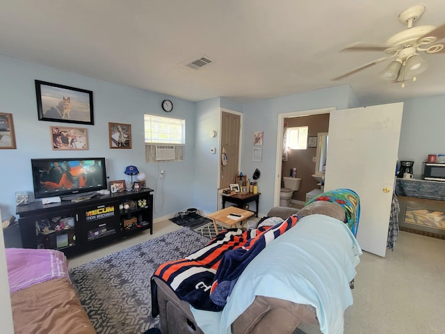 carpeted living room featuring cooling unit and ceiling fan