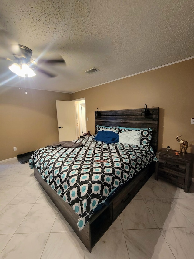 bedroom with a textured ceiling, ornamental molding, and ceiling fan