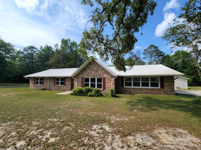 1097 Bob Mccaskill Dr, Defuniak Springs, FL 32433 - ranch-style house featuring a front yard, brick siding, and metal roof