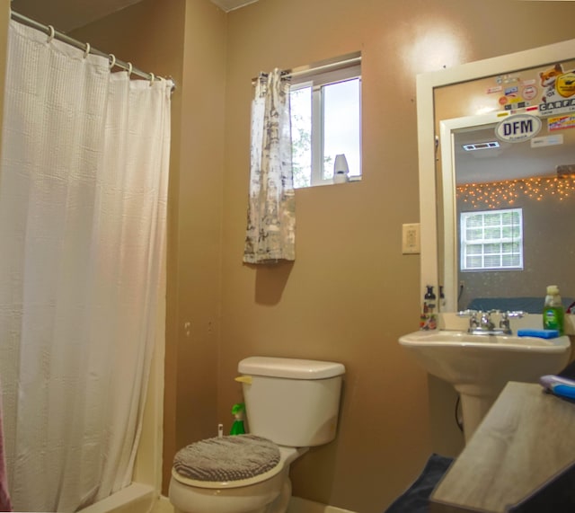 1097 Bob Mccaskill Dr, Defuniak Springs, FL 32433 - bathroom with toilet and a shower with curtain