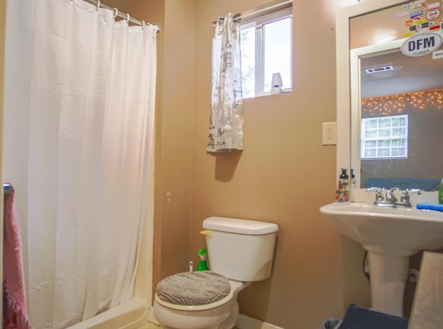 1097 Bob Mccaskill Dr, Defuniak Springs, FL 32433 - full bathroom featuring toilet, curtained shower, and a sink