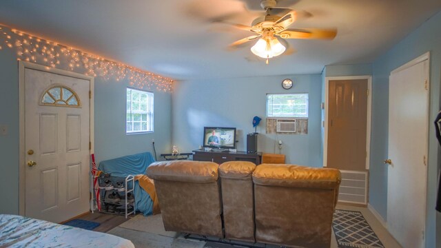 1097 Bob Mccaskill Dr, Defuniak Springs, FL 32433 - living room with a ceiling fan, cooling unit, wood finished floors, and baseboards