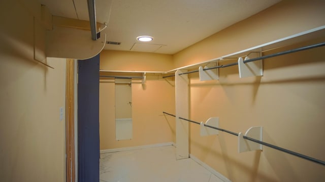 1097 Bob Mccaskill Dr, Defuniak Springs, FL 32433 - walk in closet featuring marble look tile flooring