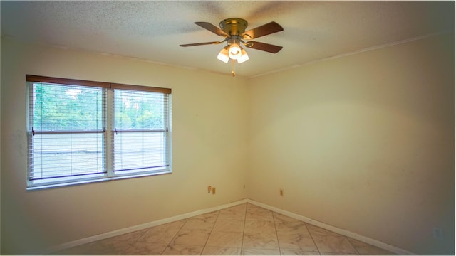 1097 Bob Mccaskill Dr, Defuniak Springs, FL 32433 - spare room featuring ceiling fan, crown molding, baseboards, and a textured ceiling