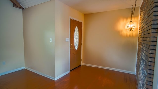 1097 Bob Mccaskill Dr, Defuniak Springs, FL 32433 - foyer entrance with wood finished floors, baseboards, and a chandelier