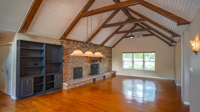 1097 Bob Mccaskill Dr, Defuniak Springs, FL 32433 - unfurnished living room with wood finished floors, a brick fireplace, ceiling fan, baseboards, and beamed ceiling