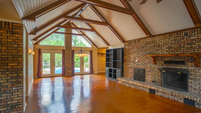 1097 Bob Mccaskill Dr, Defuniak Springs, FL 32433 - unfurnished living room featuring a fireplace, french doors, baseboards, ceiling fan, and high vaulted ceiling