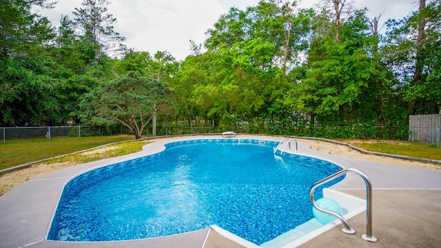 1097 Bob Mccaskill Dr, Defuniak Springs, FL 32433 - view of swimming pool with a fenced backyard and view of scattered trees