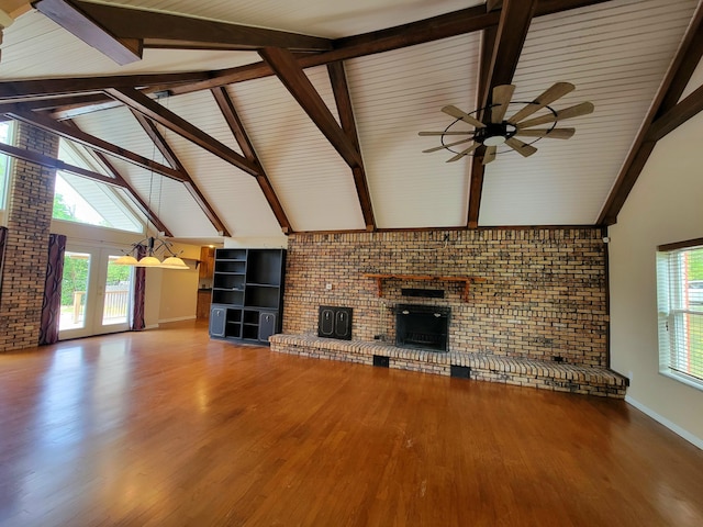 1097 Bob Mccaskill Dr, Defuniak Springs, FL 32433 - unfurnished living room featuring brick wall, a ceiling fan, a brick fireplace, wood finished floors, and baseboards