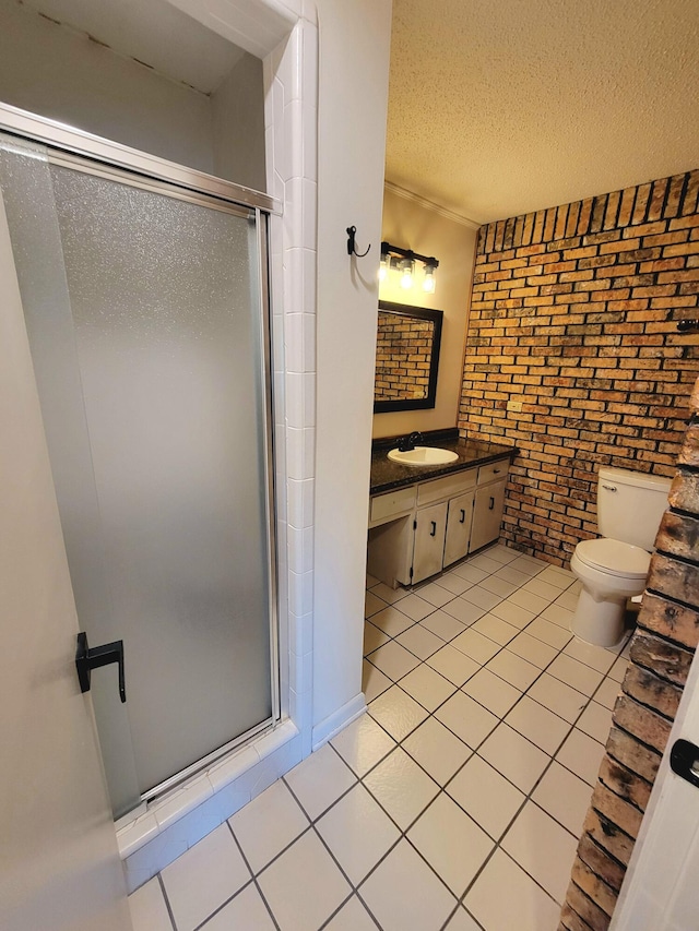 1097 Bob Mccaskill Dr, Defuniak Springs, FL 32433 - full bathroom with brick wall, a stall shower, tile patterned flooring, toilet, and vanity