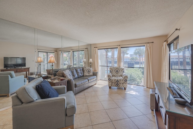 tiled living room featuring a textured ceiling