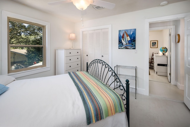 bedroom featuring a closet, ceiling fan, and light hardwood / wood-style flooring