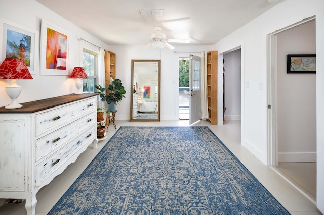 entryway featuring ceiling fan