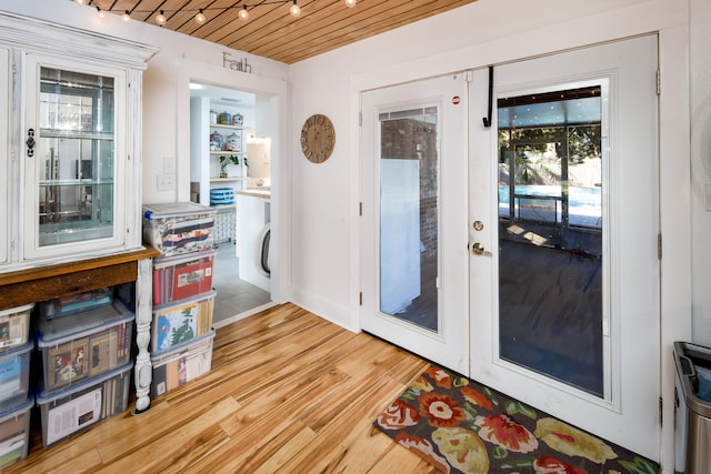 doorway to outside with wooden ceiling, light hardwood / wood-style floors, and french doors