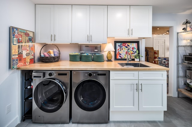 washroom featuring sink and separate washer and dryer