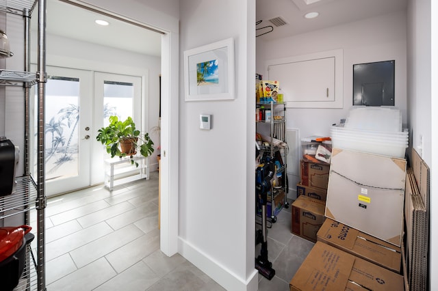 kitchen featuring french doors and light tile patterned flooring