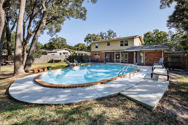 view of swimming pool with a patio