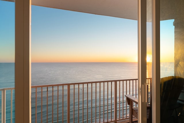 balcony at dusk with a water view