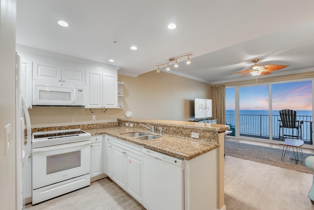 kitchen featuring white appliances, sink, kitchen peninsula, light hardwood / wood-style floors, and white cabinets