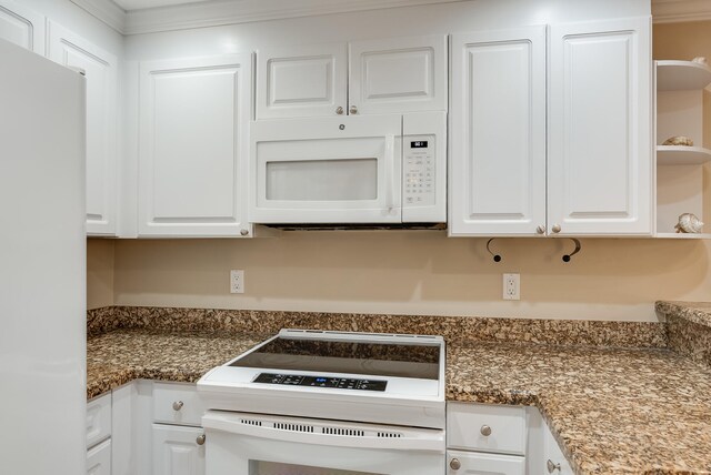 kitchen featuring crown molding, white cabinets, white appliances, and dark stone countertops