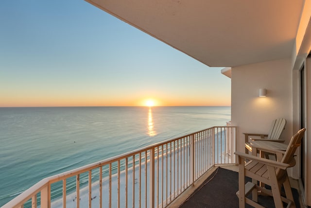 balcony at dusk with a water view