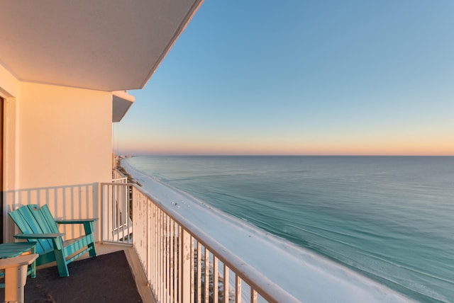 balcony at dusk with a water view