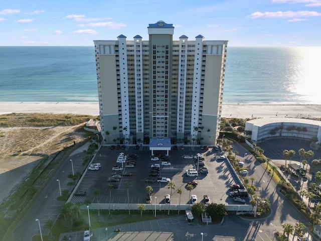 bird's eye view featuring a water view and a beach view