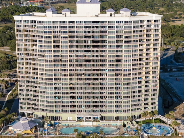 view of building exterior with a swimming pool