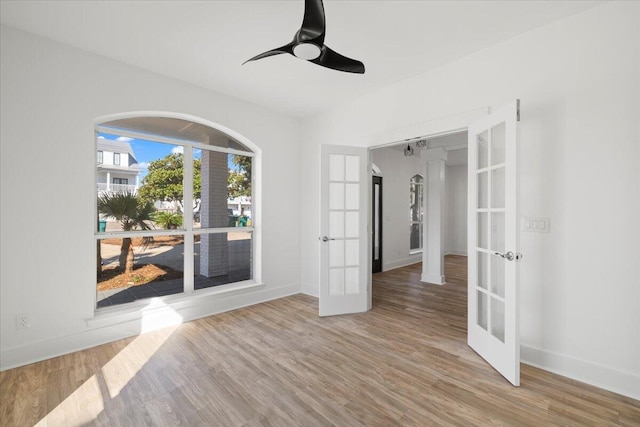 empty room featuring light hardwood / wood-style floors and french doors