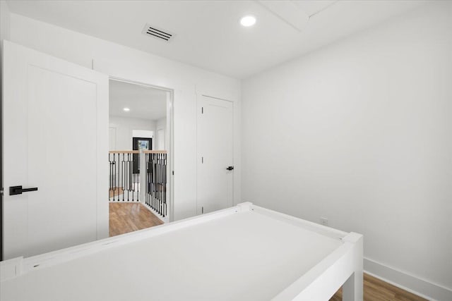 bedroom with hardwood / wood-style flooring