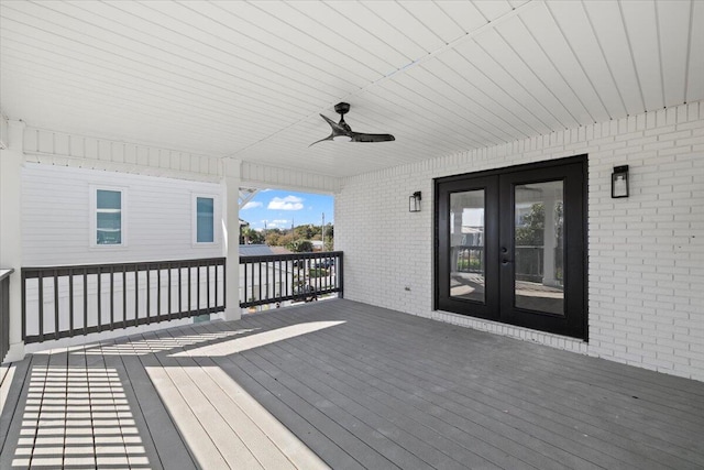 wooden deck with french doors and ceiling fan