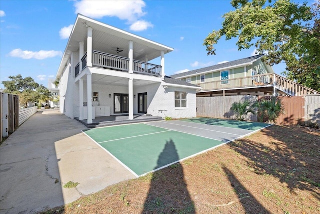 back of property featuring basketball hoop