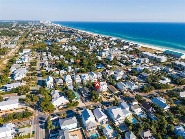 aerial view with a water view and a view of the beach