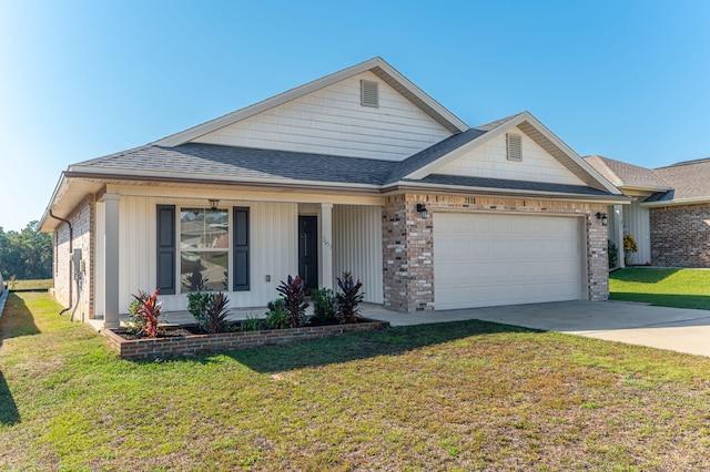 view of front of house featuring a front lawn and a garage