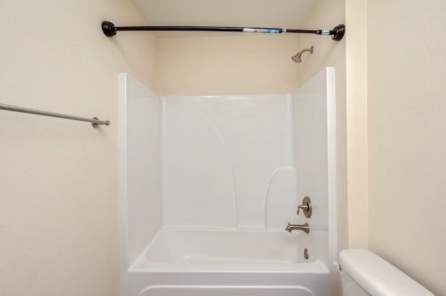 bathroom with toilet and shower / bathtub combination