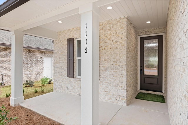 entrance to property featuring a patio