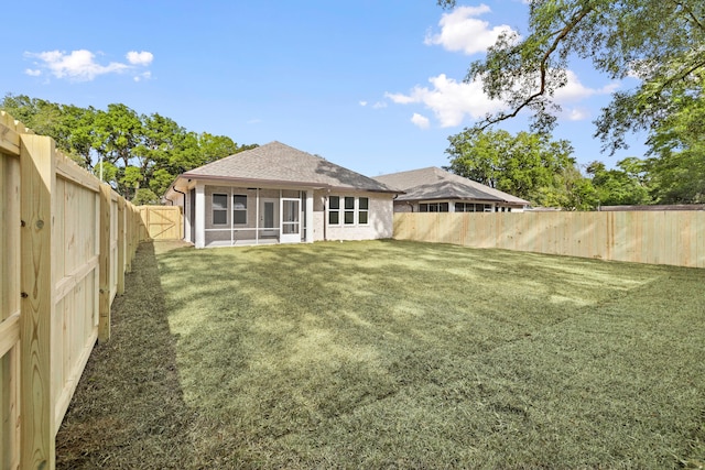 view of yard featuring a sunroom