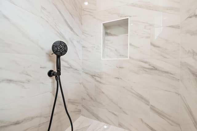 room details with a tile shower