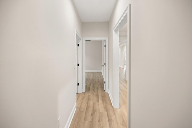 corridor featuring light hardwood / wood-style floors