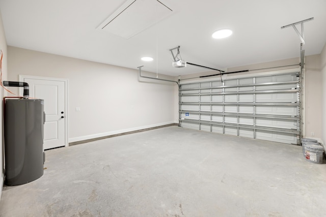 garage featuring water heater and a garage door opener