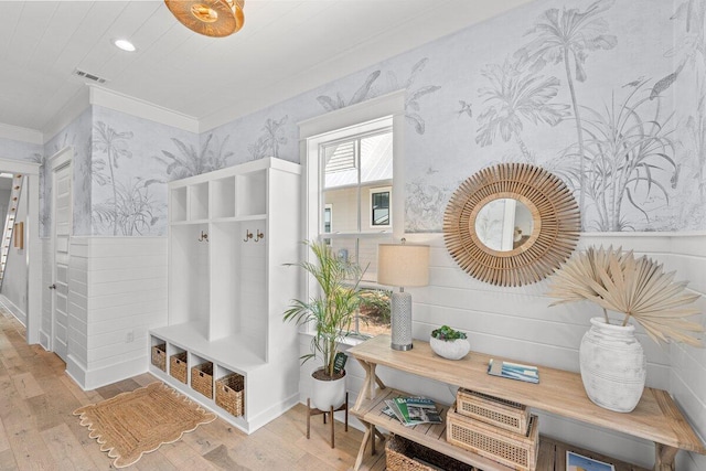 mudroom featuring ornamental molding and light hardwood / wood-style flooring