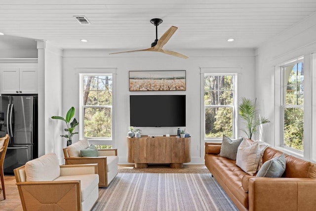 living room with light hardwood / wood-style floors, wood ceiling, and ceiling fan