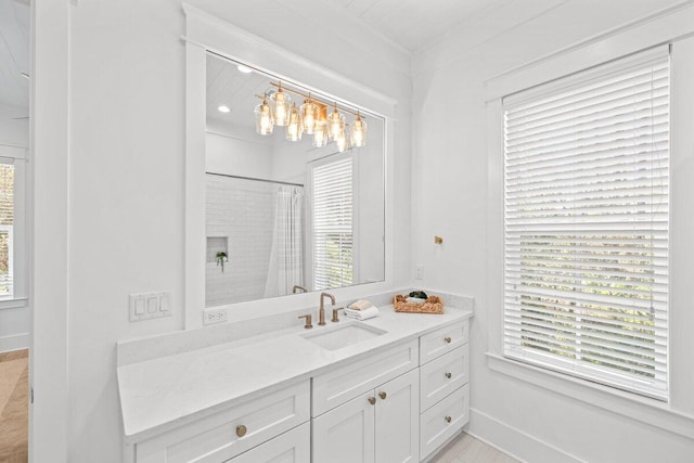 bathroom featuring vanity, curtained shower, and plenty of natural light