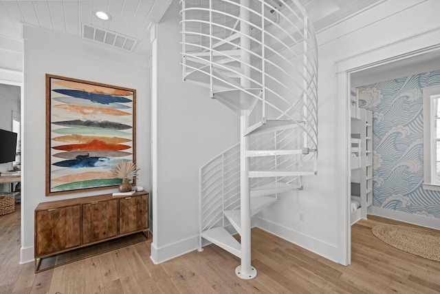 stairs with wood-type flooring