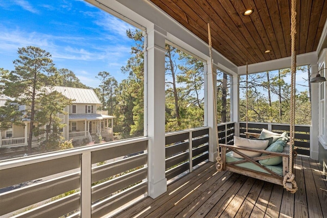 unfurnished sunroom with wooden ceiling