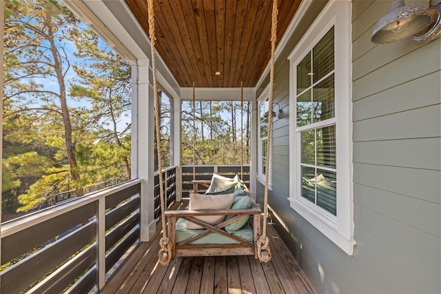 sunroom with wood ceiling and plenty of natural light