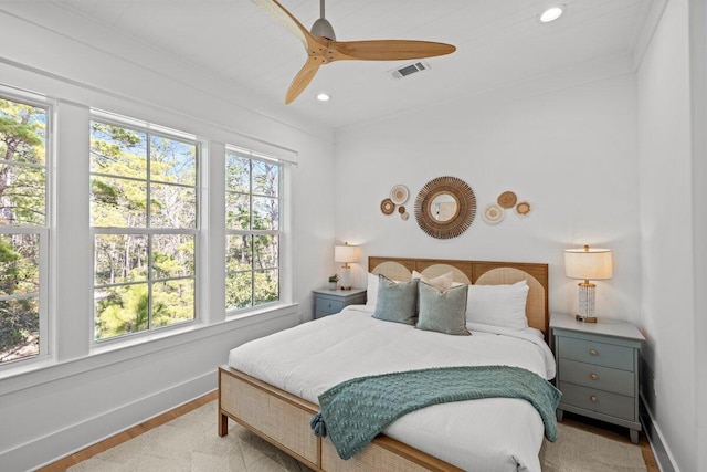 bedroom with light hardwood / wood-style flooring, multiple windows, wooden ceiling, and ceiling fan