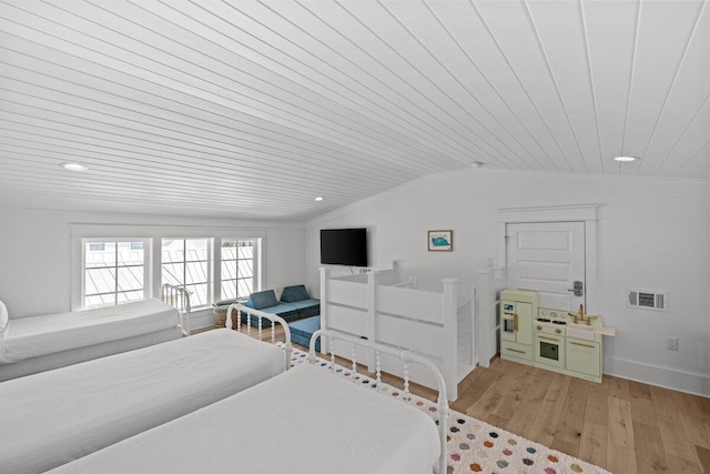 bedroom featuring light hardwood / wood-style floors, wooden ceiling, and vaulted ceiling