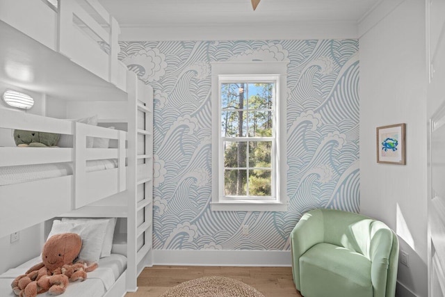 bedroom featuring crown molding and hardwood / wood-style flooring